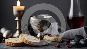 Communion still life unleavened bread chalice of wine silver kiddush wine cup on grey background