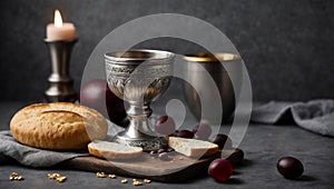 Communion still life unleavened bread chalice of wine silver kiddush wine cup on grey background