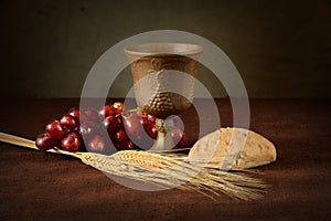 Communion Table With Wine Bread Grapes and Wheat photo