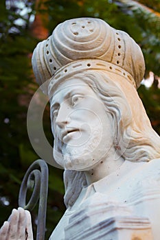 Saint Coleman White Stone Religious Figure in the Courtyard