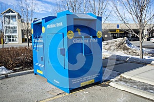 Community Clothing Donation Bin - Container in Park Lot