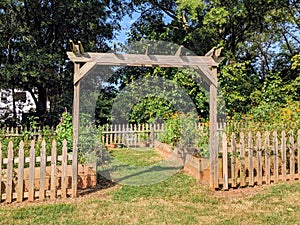 Community garden trellis with wood fence