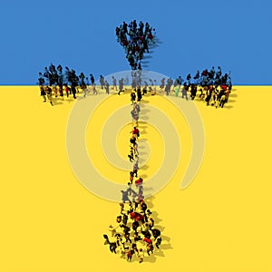 Community  of people forming the image of religious Christian cross on Ukrainian flag