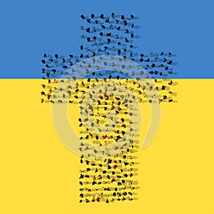 Community  of people forming the image of religious Christian cross on Ukrainian flag