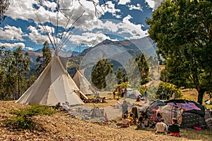 community of people in a teepee camp on a mountain in cusco peru on a vision quest