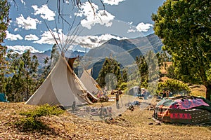 community of people in a teepee camp on a mountain in cusco peru on a vision quest