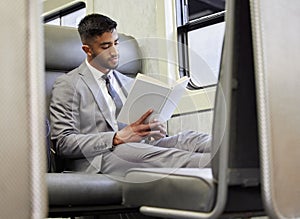 Commute, book and businessman in train for reading for knowledge, fiction novel and morning travel. Indian male lawyer