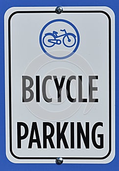 Commuter cycling infrastructure sign showing bicycle parking near a storage rack