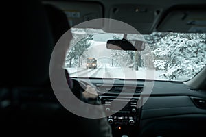 A commuter driving in a winter snow storm