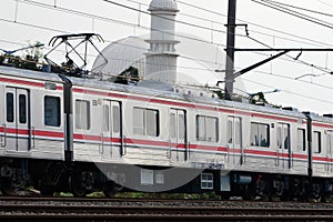 Commuter Line or electric train in Jakarta, Indonesia. In the photo from the right angle, which illustrates the splendor of this