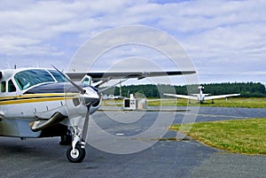 Commuter planes in airfield photo