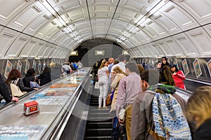 Commuters on elevators of a tube station in London