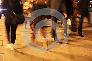 Commuters on London Bridge at night