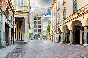 Como city, historic center, lake Como, northern Italy. Medieval tower 12th century, called Porta Torre and via CantÃ¹