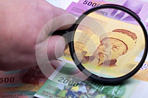 Comorian money in a magnifying glass photo