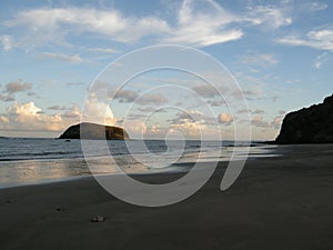 Comoros beach with a rock, sunset