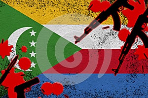 Comoros flag and guns in red blood. Concept for terror attack and military operations