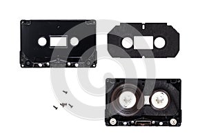 Compact audio cassette detail part disassembled state isolated. Inside view compact audio cassette black plactic body