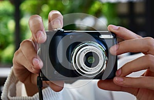 A compact black digital camera that still captures beautiful and sharp images