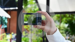A compact black digital camera that still captures beautiful and sharp images