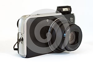 Compact digital camera on white background