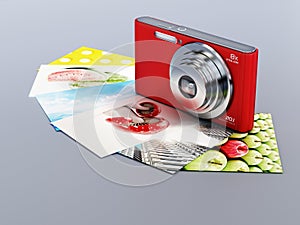 Compact digital camera and photos isolated on gray background. 3D illustration