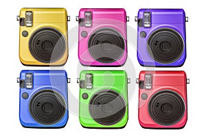 Compact digital cameras of various colors isolated on white background