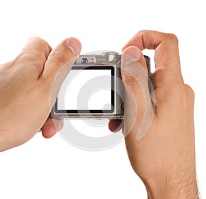 Compact digital photo camera held in hands