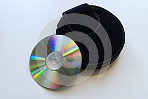 Compact disc and a black case on white background. Technology from the 90s