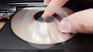 The Compact Disc is Inserted Into The DVD Player