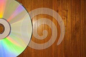 Compact disc on a Wooden Background