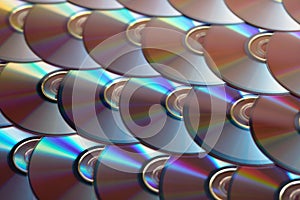 Compact discs background. Several cd dvd blu-ray discs. Optical recordable or rewritable digital data storage.