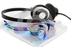 Compact Discs (CDs) with headphones
