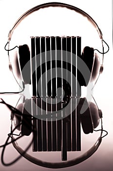 Compact discs plugged-in into headphones photo