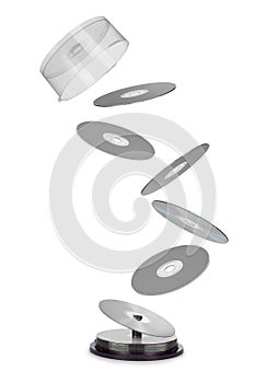 Compact disks fly out of the box isolated on white