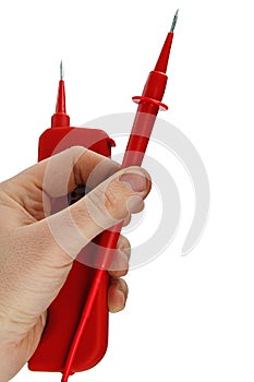 Compact electric live voltage detector with needle shaped probes, one probe detached from the body, held in left hand