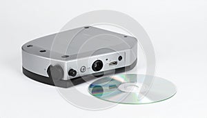 Compact External Device and Mini Disc on White Background