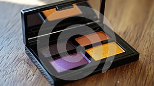 A compact eyeshadow palette featuring four vibrant shades for makeup application
