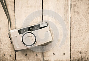 Compact film camera on wood