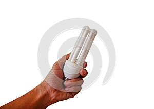 Compact fluorescent lamp or energy saving light bulb in the hand, isolated on a white background.