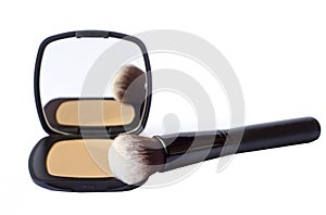 compact foundation with brush and mirror isolated in white background