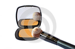 compact foundation with brush and mirror isolated in white background