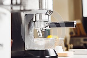 Compact Semi-Professional Metallic Coffee Machine in Indoor Setting
