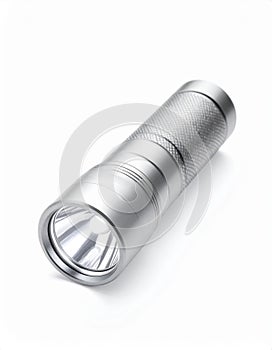 Compact Silver Metal Flashlight on White Background