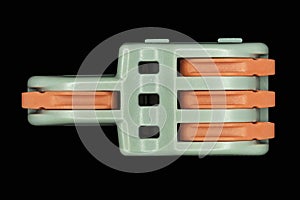 Compact splicing connector isolated on black background.