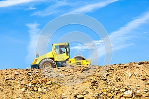 compaction machine at the construction site for compacting the loam