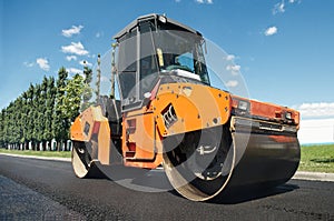 Compactor at asphalt pavement works photo