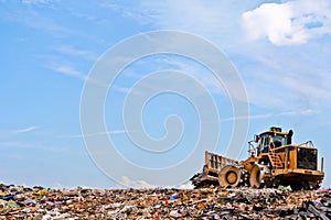 Compactor on a hill at a landfill photo