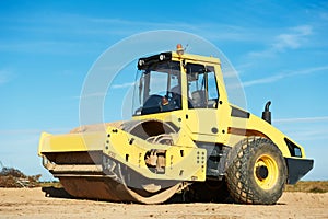 Compactor at road compaction works photo