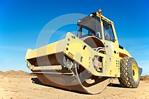 Compactor at road compaction works photo